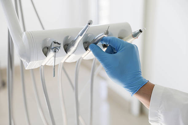 Professional Tooth Extraction technician working in Mustang, OK